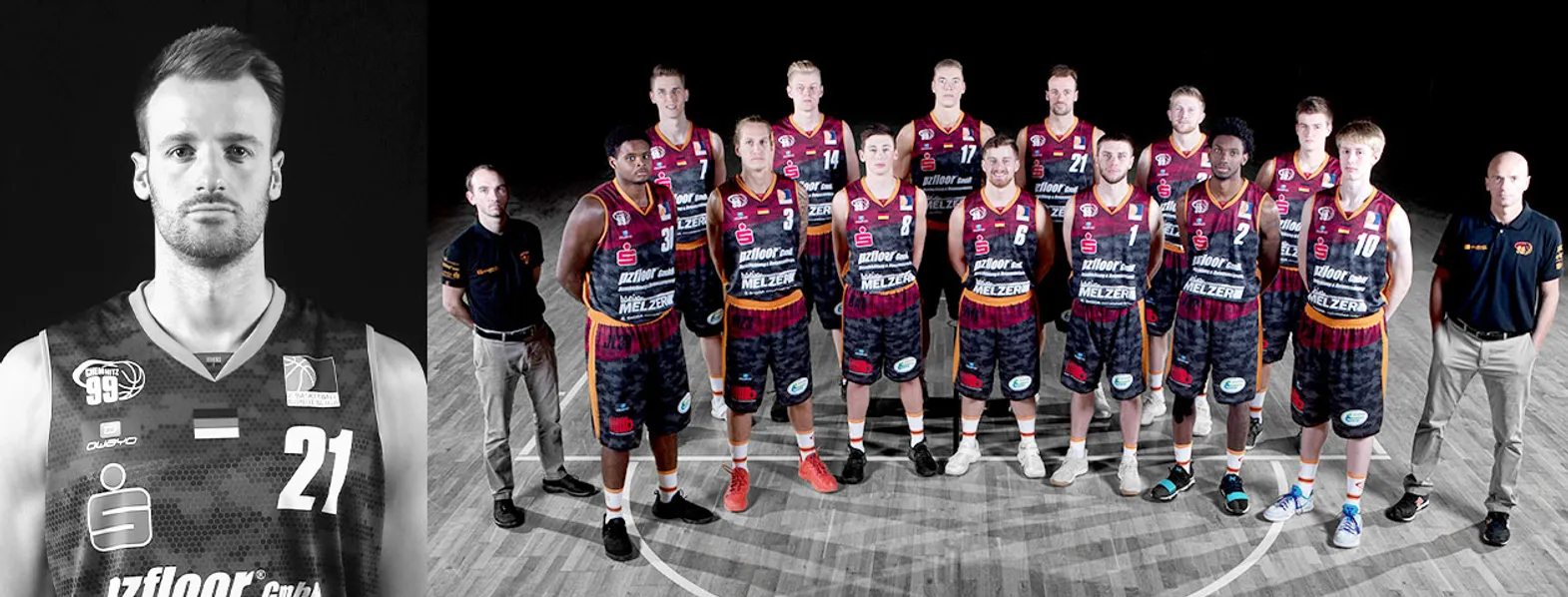 A basketball team in dark jerseys with orange and red accents poses on a basketball court, while a man in the foreground wears a jersey with the number 21.