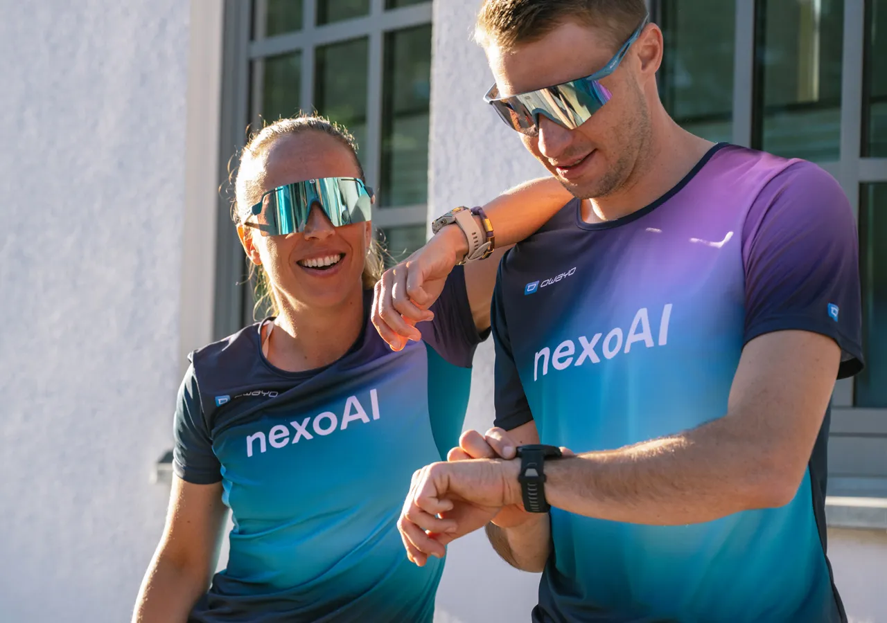 Two sportily dressed individuals in customized t-shirts are enjoying themselves while looking at their watches.